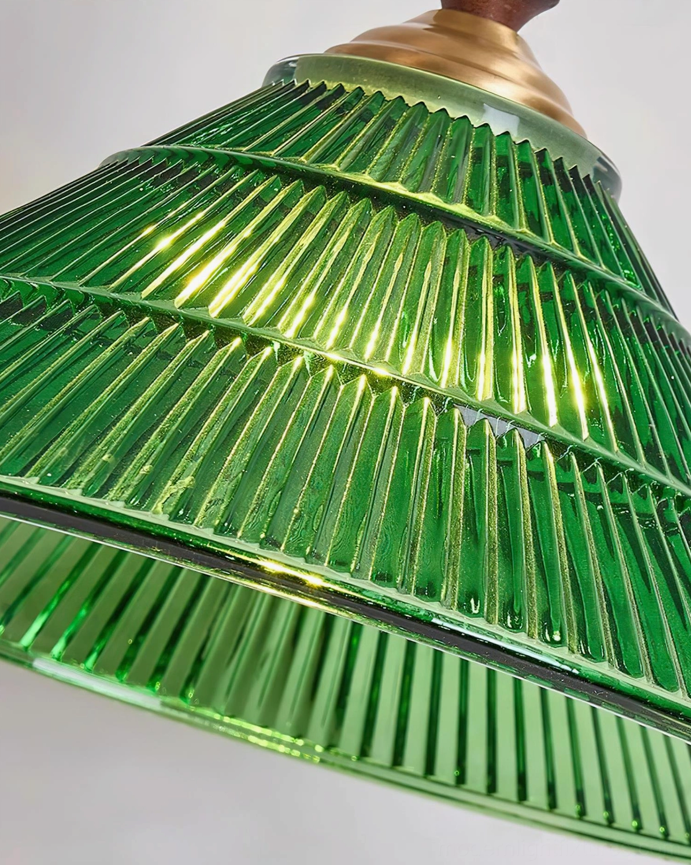 Retro green glass pendant light installation above kitchen island counter lighting solution