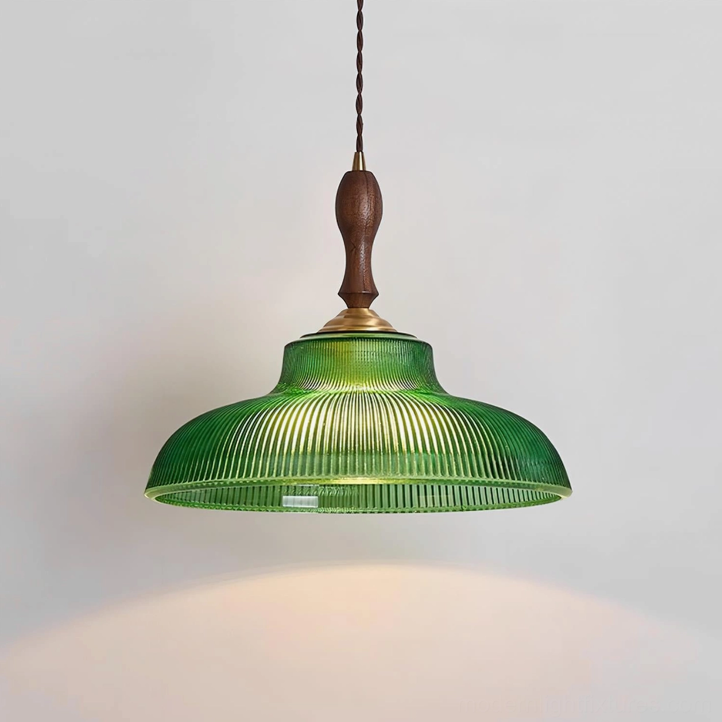 Retro green glass pendant light fixture detail showing brass socket and wood finial assembly