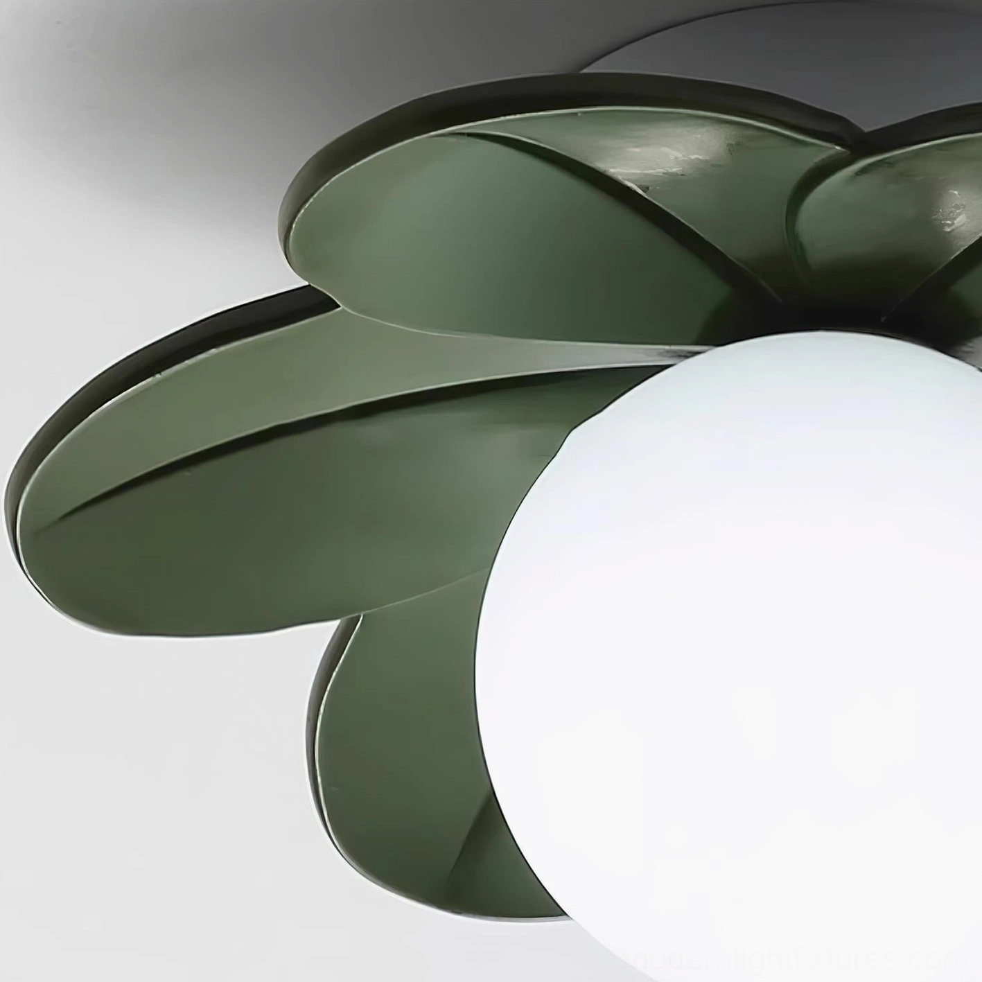 Green botanical petal ceiling light showing petal silhouette detail and frosted glass globe integration