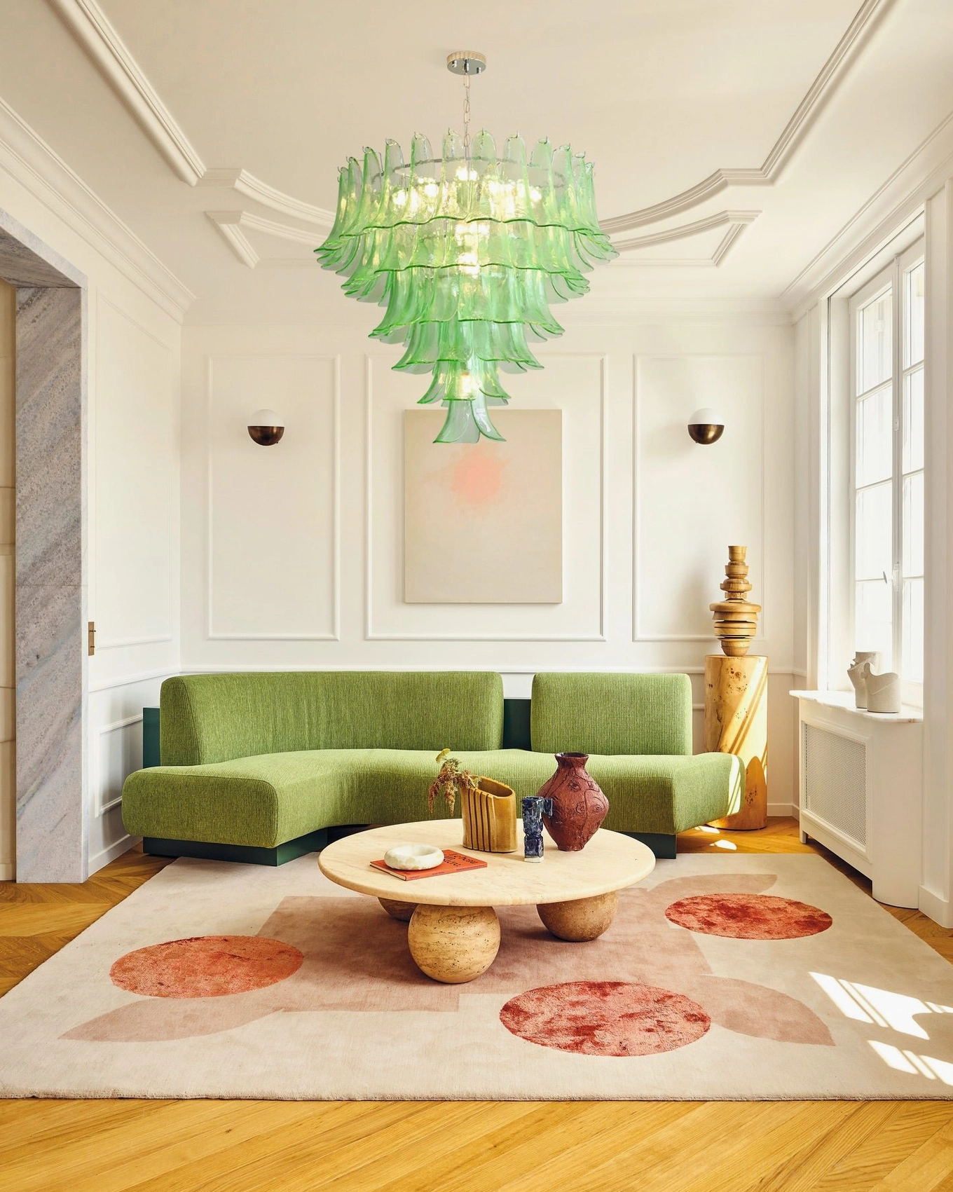 Green glass petal chandelier mounted in entryway foyer creating welcoming architectural focal point