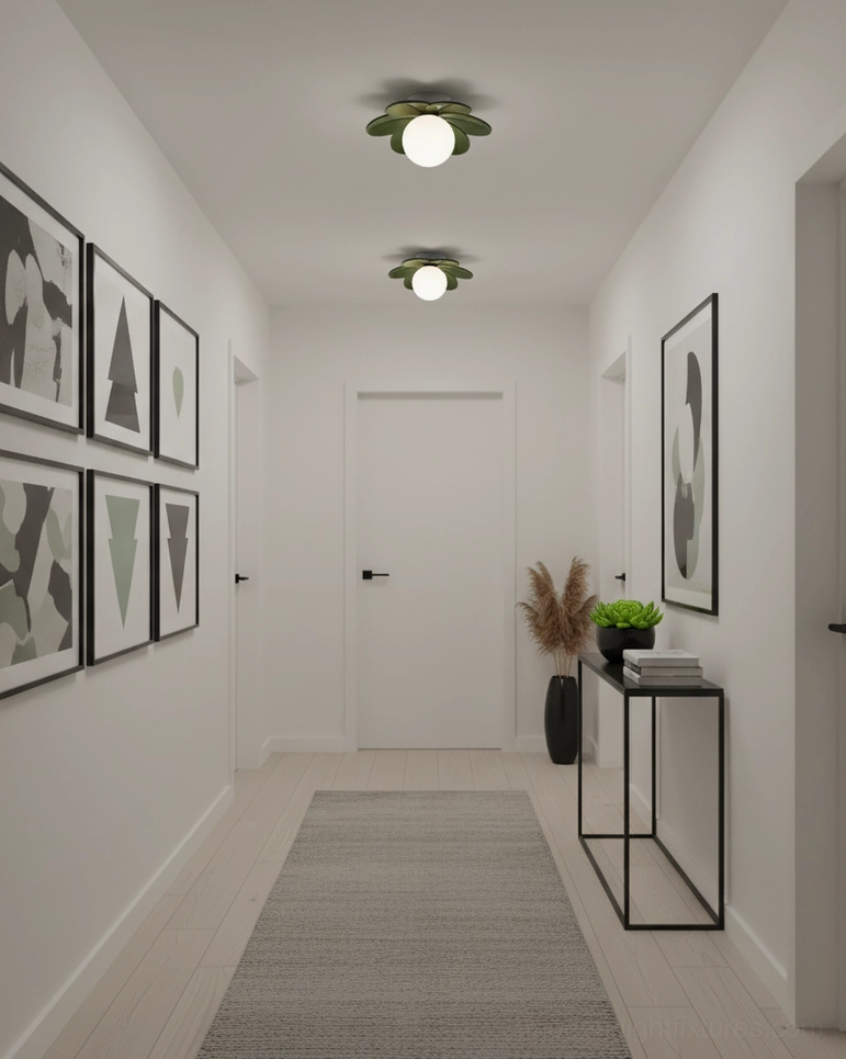 Dark green botanical ceiling light fixtures in narrow entry hallway with matching green base and contemporary wall artwork