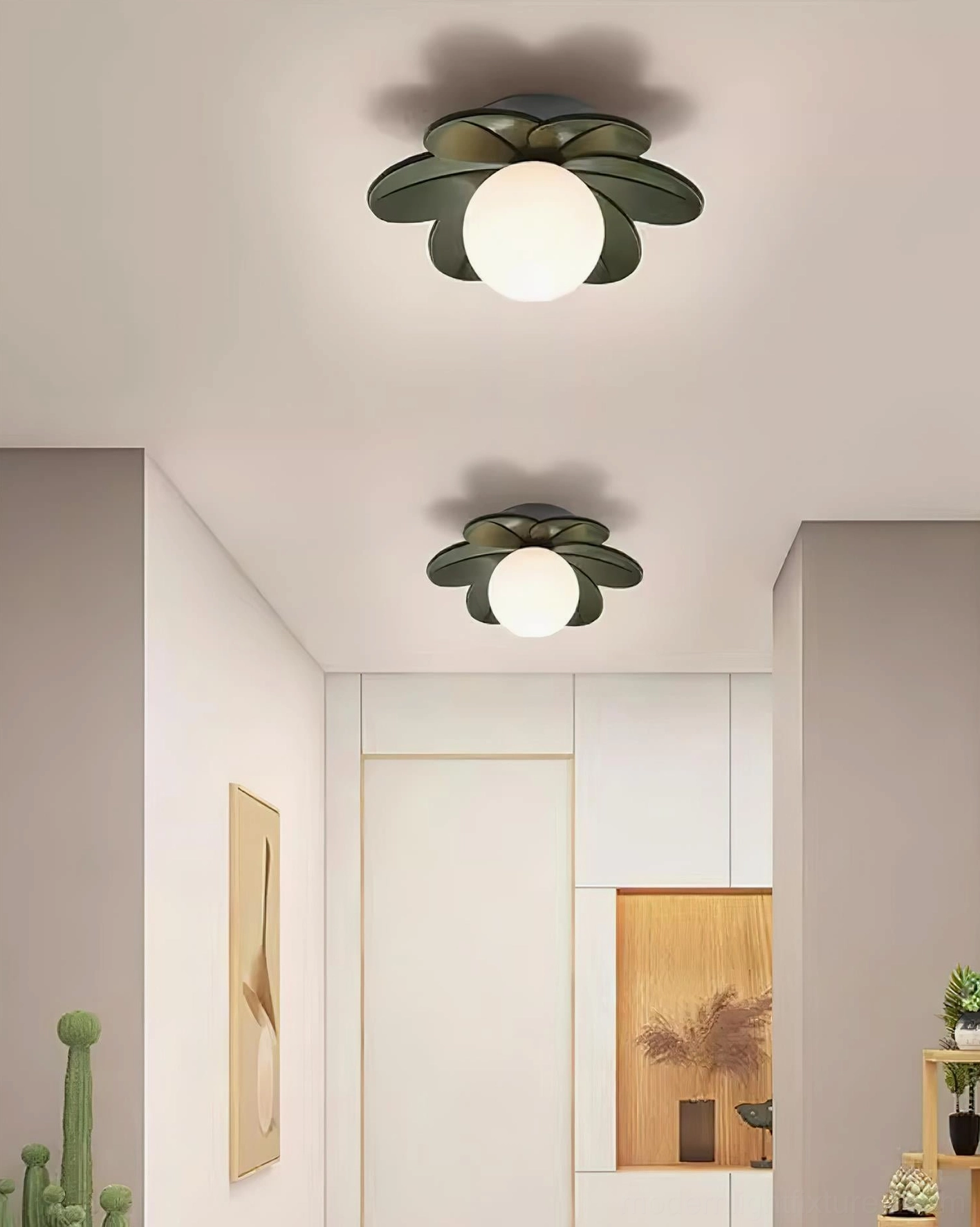 Dark green resin petal ceiling fixtures installed in modern residential hallway with wall art accents