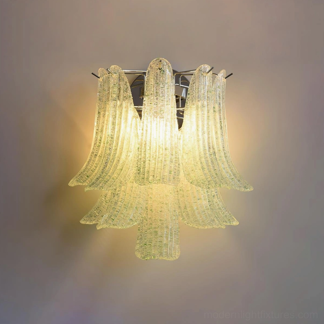 Green petal glass wall sconce glowing with sophisticated color palette perfect for botanical and eclectic interior design