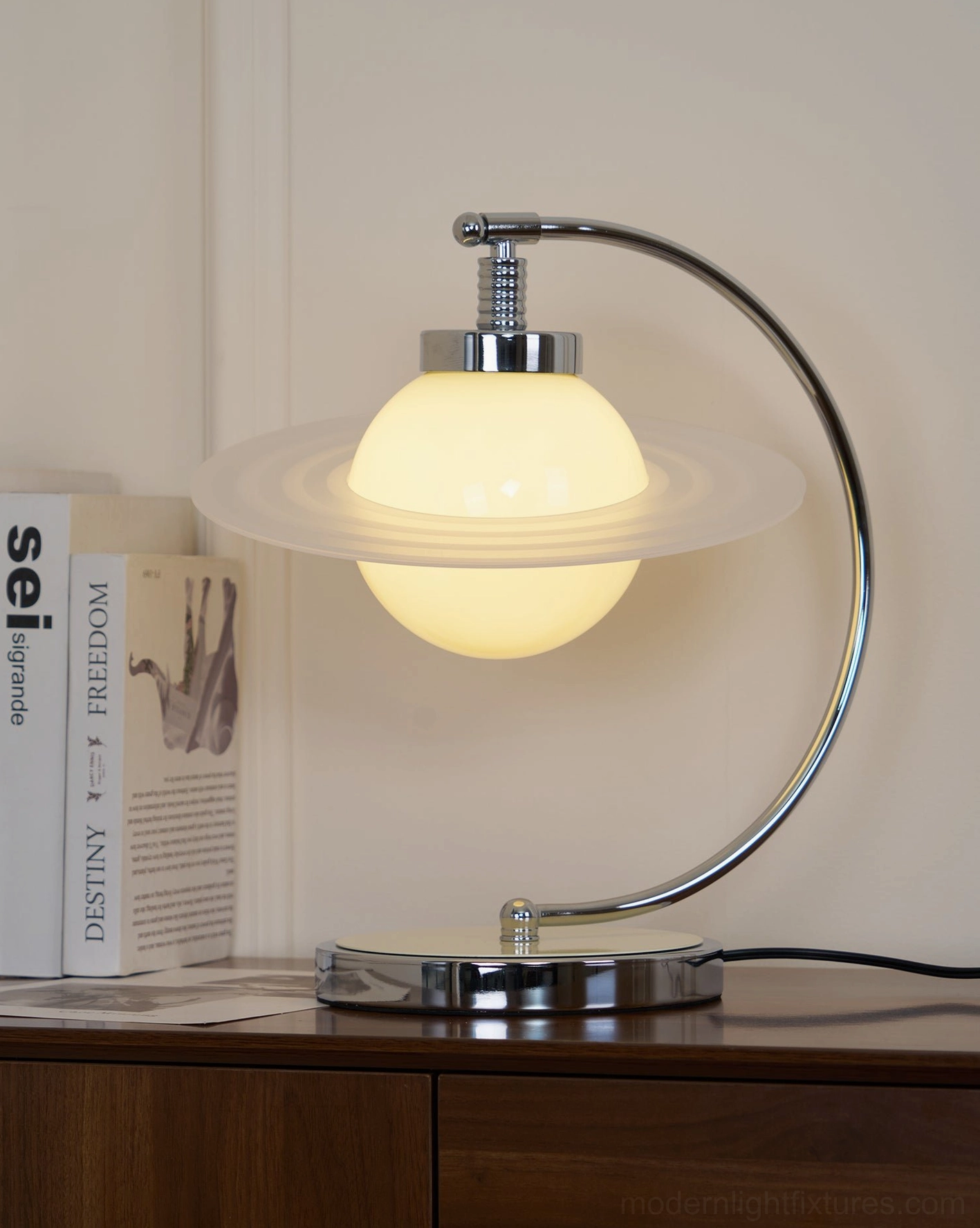 Illuminated green table lamp emitting warm yellow light in home bedroom or living room setting