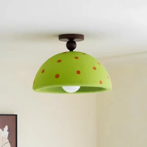 Green polka dot modern ceiling lamp mounted with dark wood canopy base in residential corner