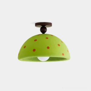 Lime green polka dot dome ceiling light fixture with hand-applied dots in studio setting