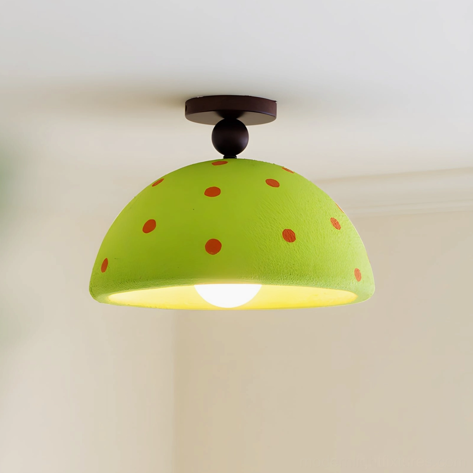Green polka dot ceiling light pendant in contemporary interior with artistic styling
