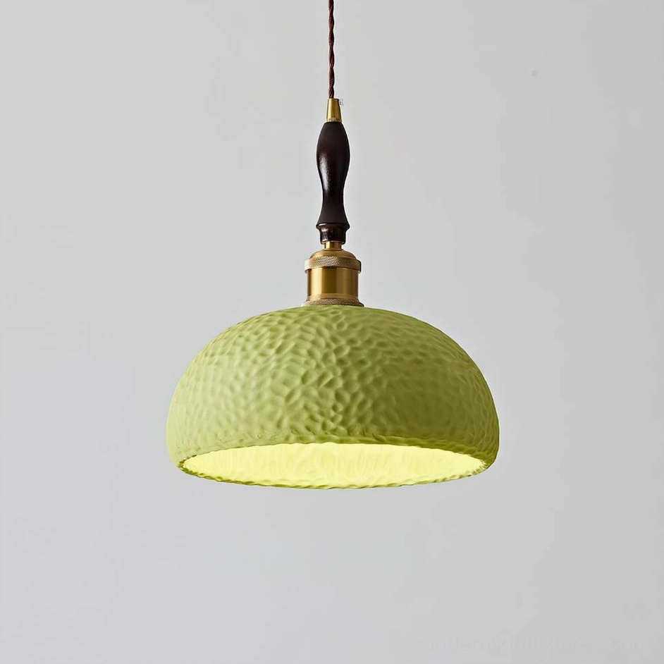 Green textured resin dome pendant light with brushed metal hardware, studio product photography