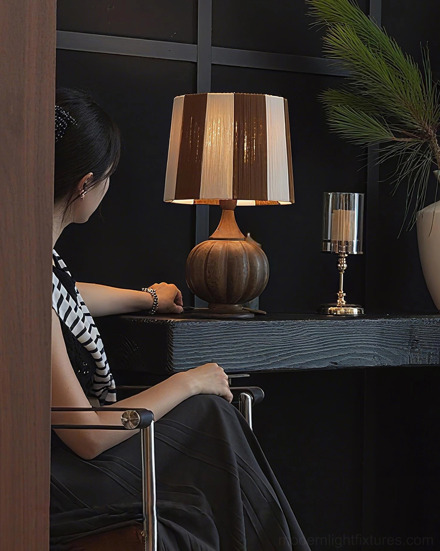 Green cream striped wooden table lamp styled in mid-century modern interior with contemporary furnishings