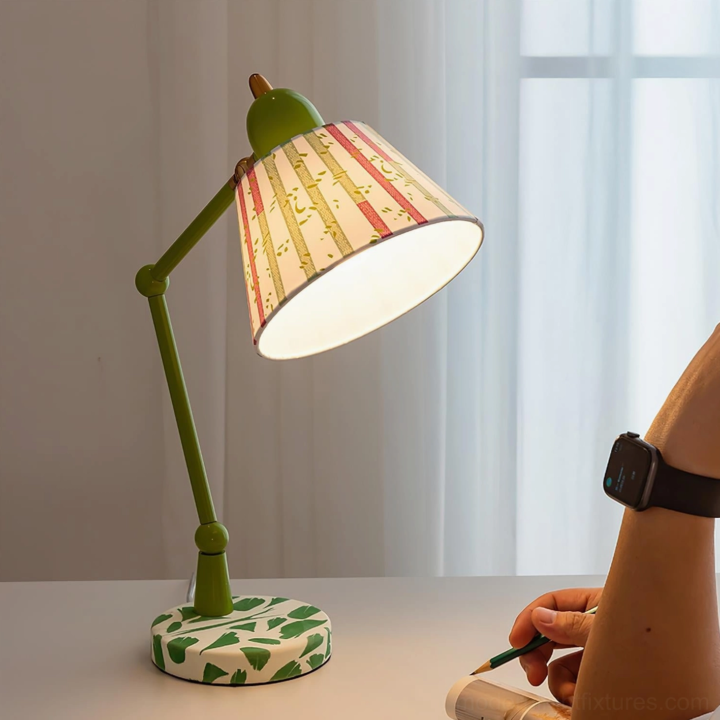 Contemporary green swing arm lamp positioned beside sofa in living room accent setting with white striped shade