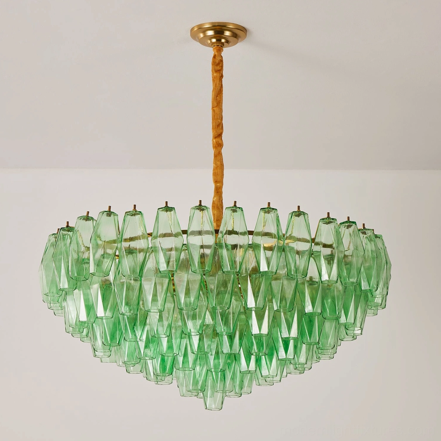 Green hand-blown glass tiered chandelier with multi-layer glass prisms and brass gold hanging rod, low-angle view