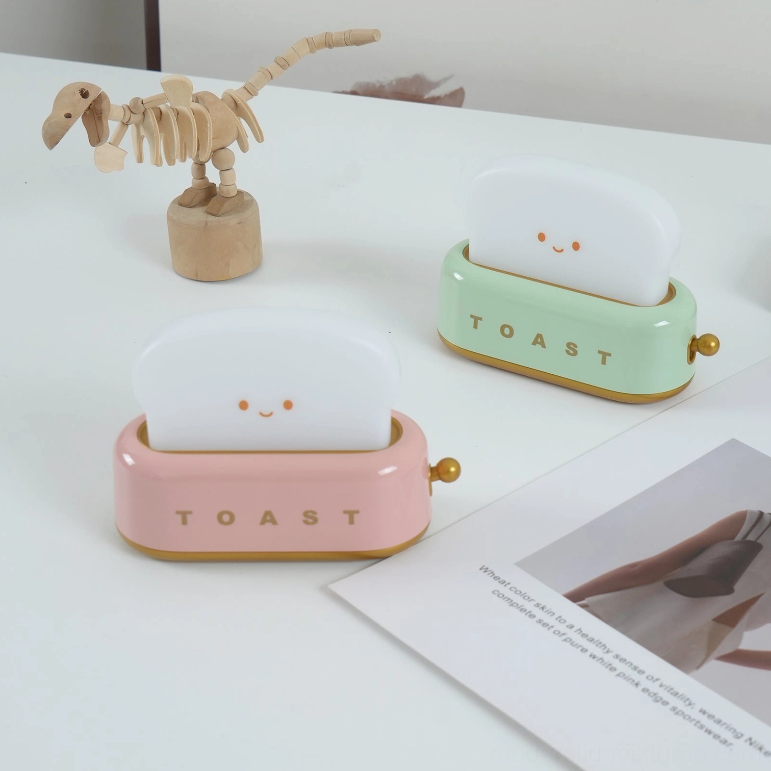 Green toaster table lamp creating warm accent light layer for ambient home atmosphere