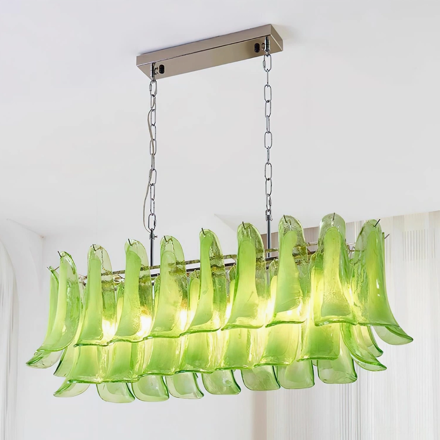Green tulip leaf chandelier with vibrant Murano glass in upscale contemporary dining room