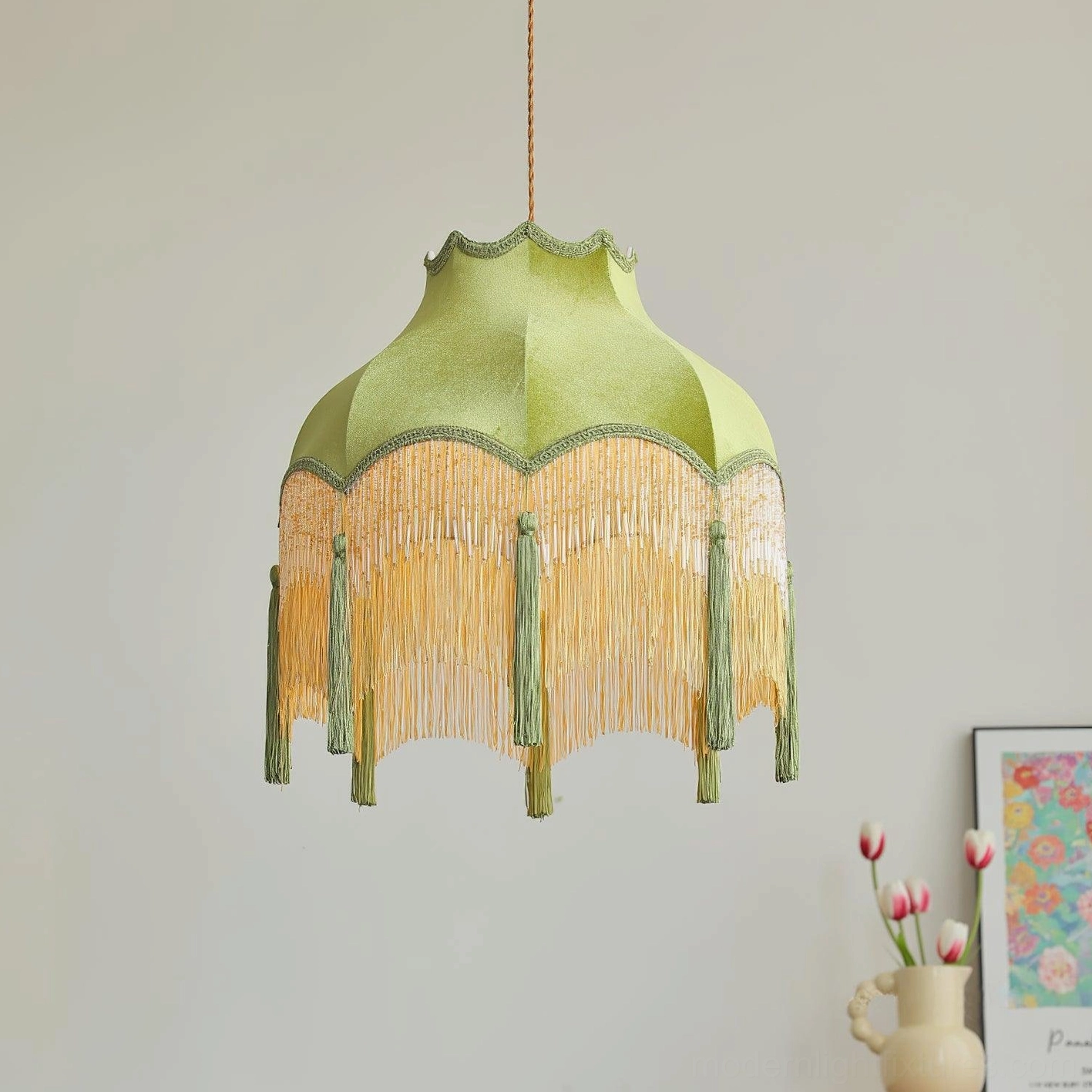 Green velvet tassel pendant light as focal point in maximalist room design