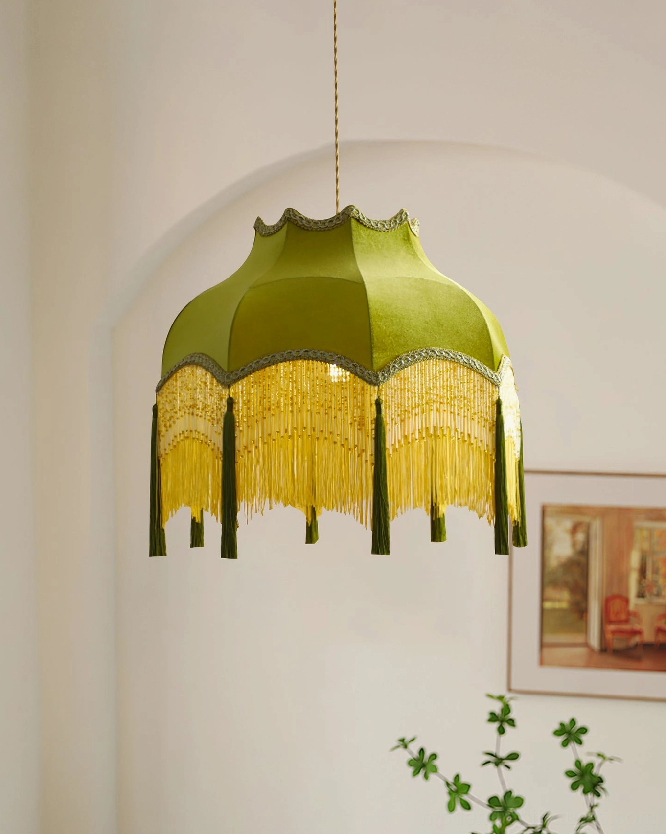 Close-up side view of green velvet tassel pendant showing scalloped shade detail