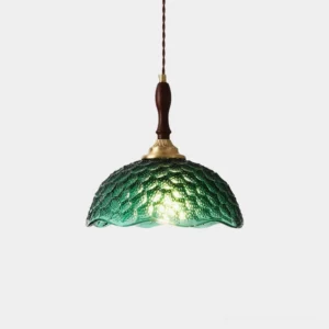 Grevia vintage scalloped glass pendant lamp with dark green embossed shade, brass hardware, studio front view