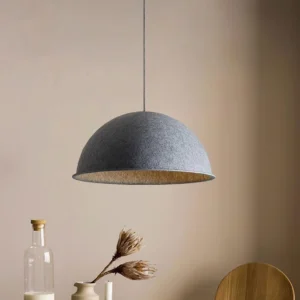 Eco-friendly pendant light with grey felt shade in warm indoor wabi-sabi dining setting