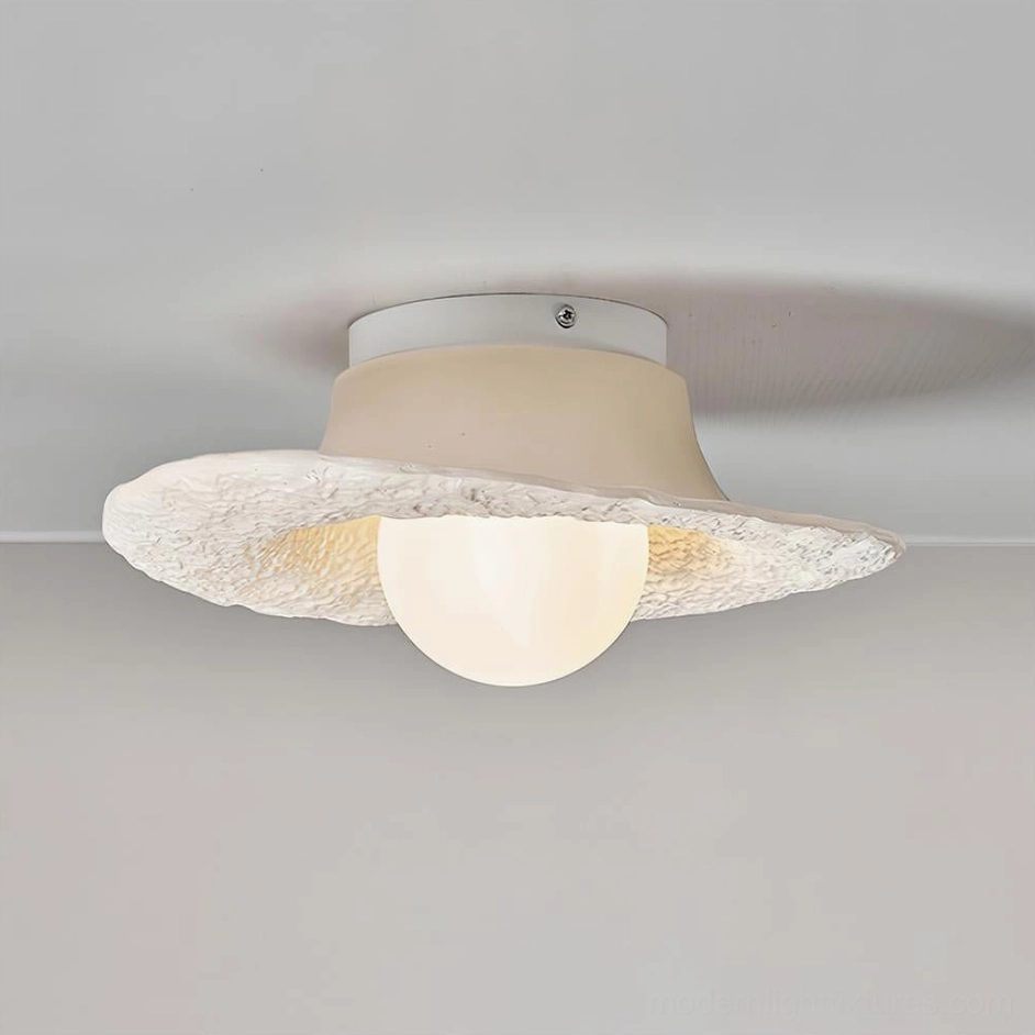 Grima hat ceiling light in soft beige finish with warm neutral studio background and matte textured surface