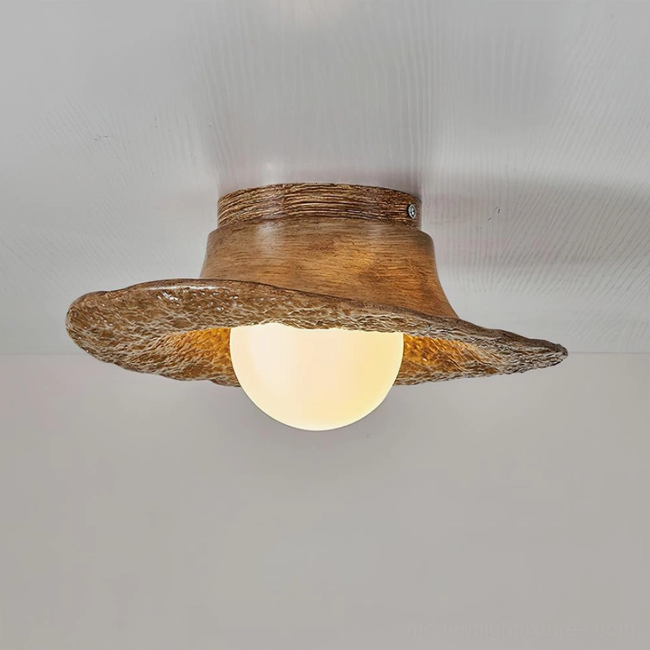 Grima hat ceiling light with warm wood brown finish, close-up detail of uneven textured brim design