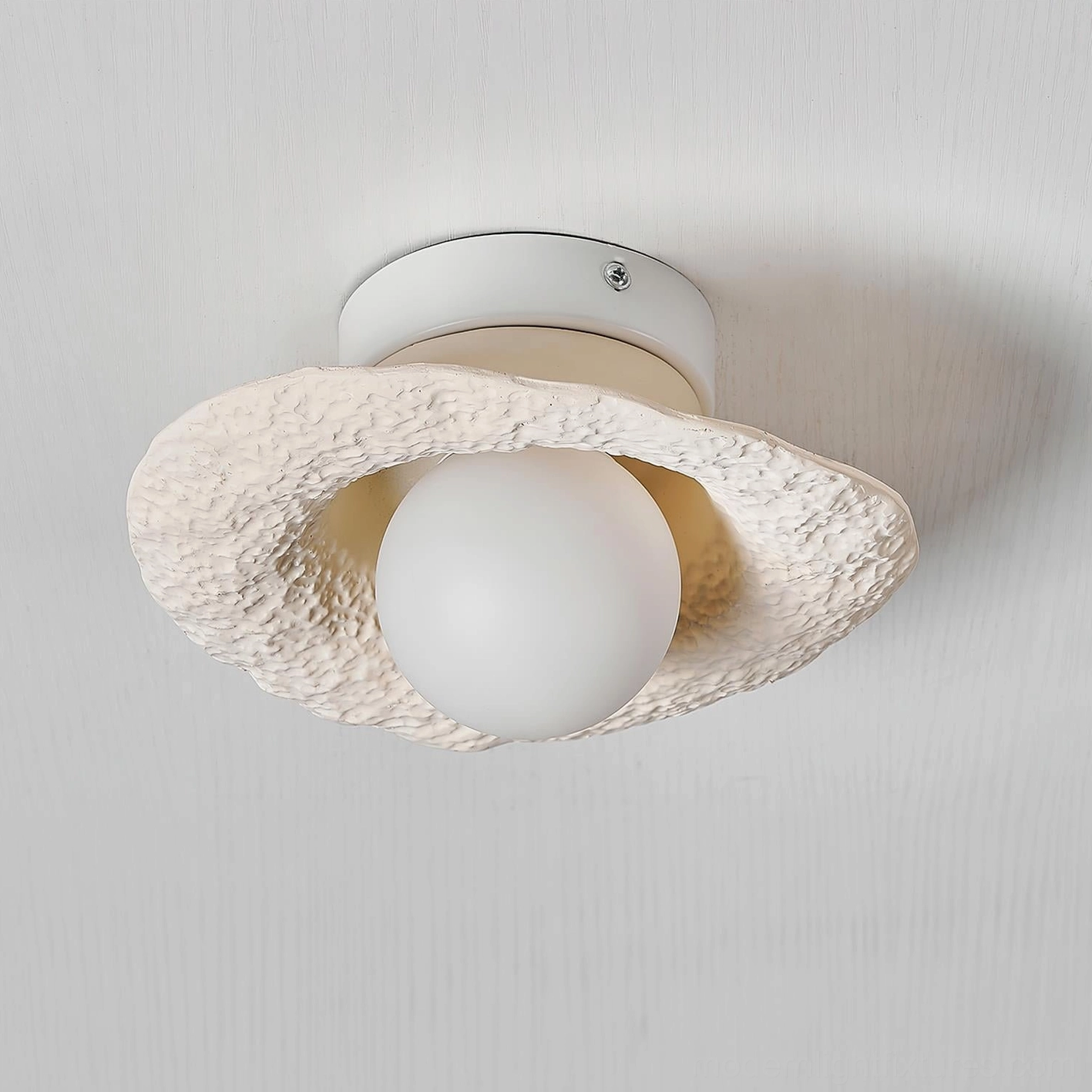Grima off-white textured hat ceiling fixture side close-up profile view with uneven sculptural brim
