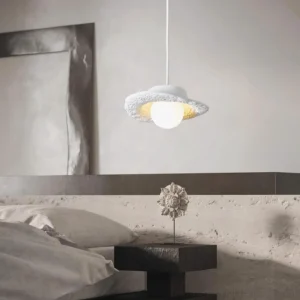 Modern minimalist pendant light in white finish hanging in contemporary bedroom interior