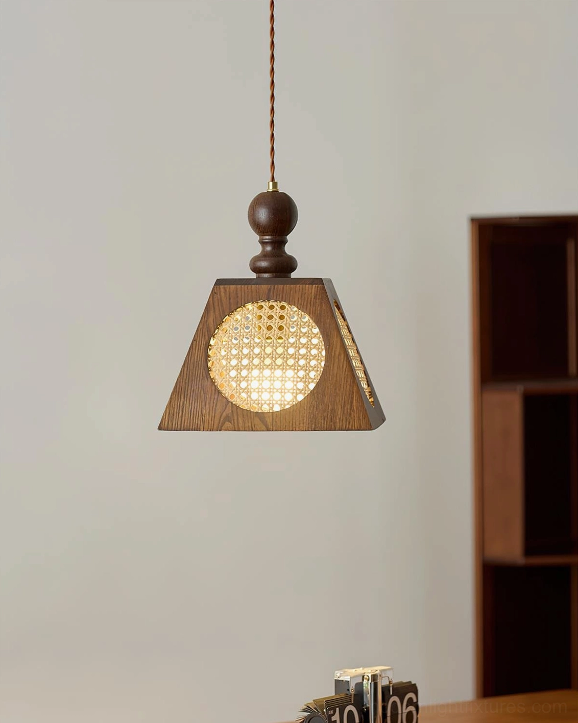 Grove rattan mesh pendant light side profile studio white background
