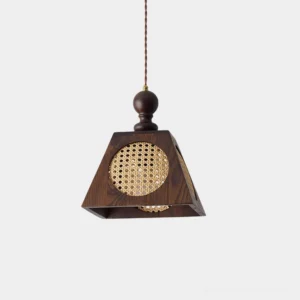 Grove handwoven rattan pendant light with walnut wood frame, front studio view