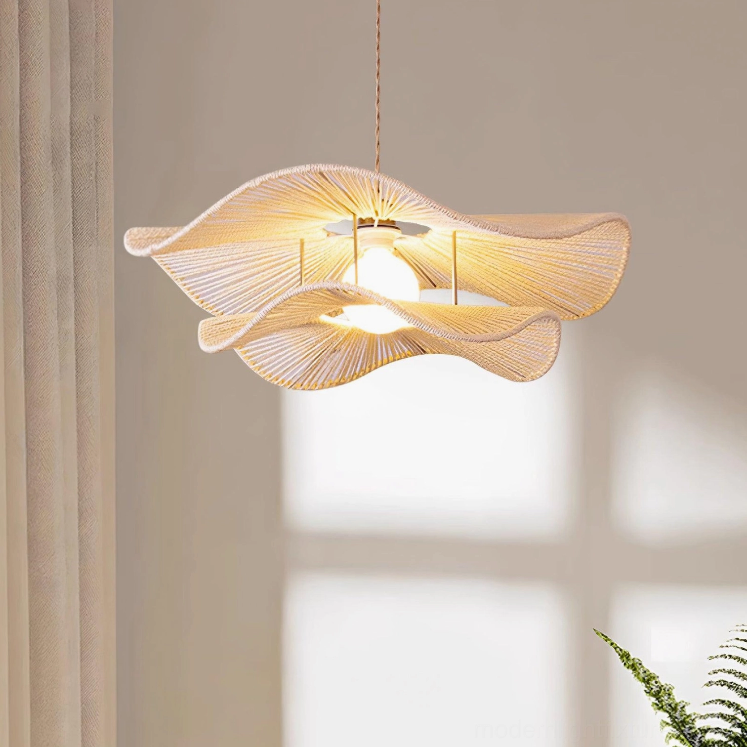 Gunilla woven hemp rope pendant light full profile view demonstrating sculptural design and shadow play potential