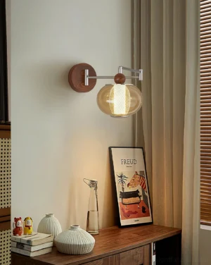 Gyro wall sconce installed in retro home interior with warm ambient lighting and adjustable arm
