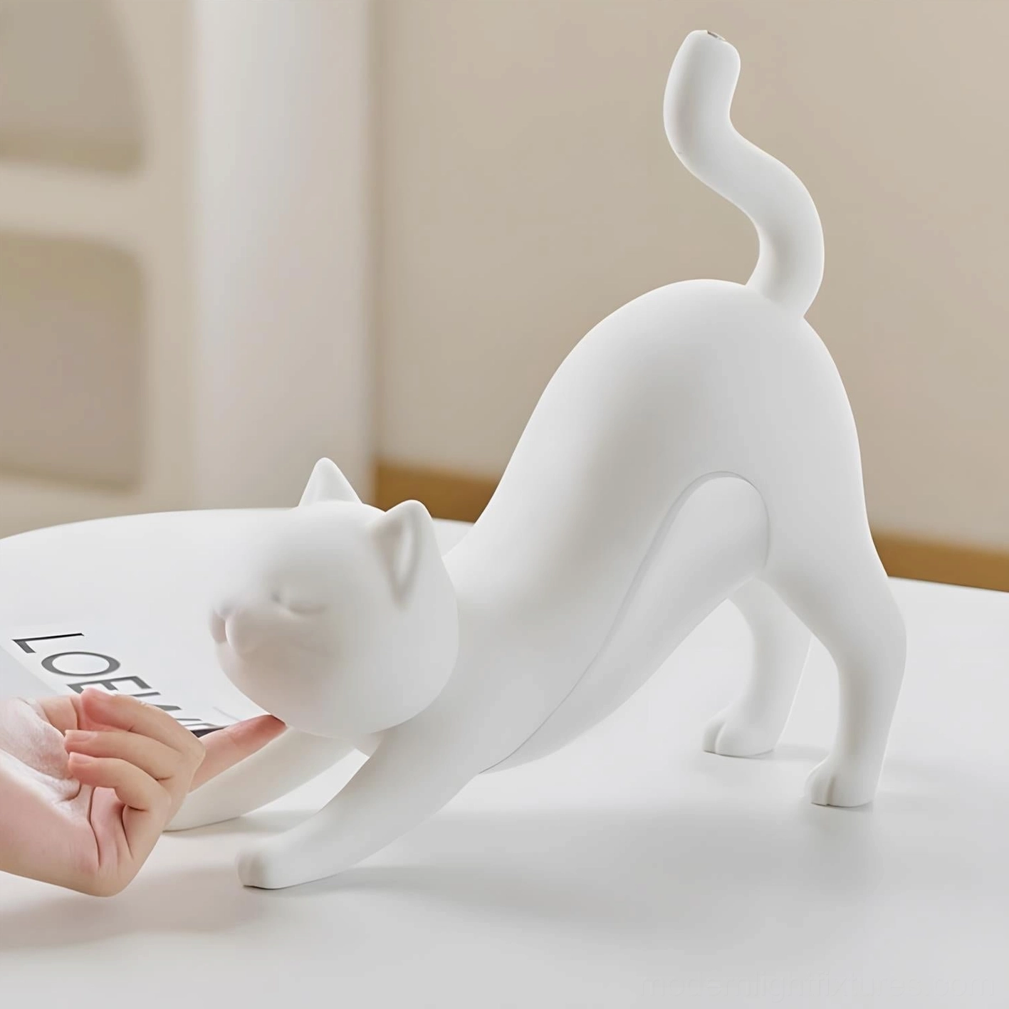 Hakimi cat table lamp aerial view highlighting elegant arched back and form
