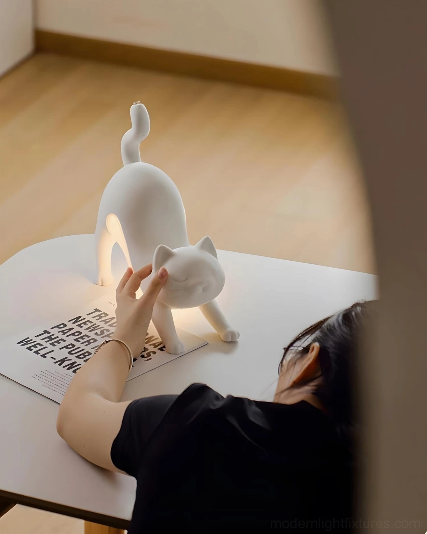 White cat table lamp on home office desk as contemporary sculptural lighting accent