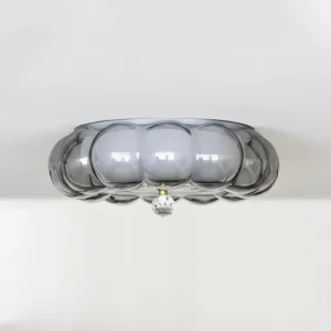 Modern glass ceiling light fixture showing dual-layer smoke glass design with crystal hanging ornament, angled perspective view