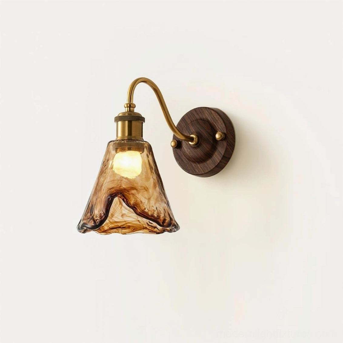 Warm amber wall sconce mounted in residential hallway creating welcoming entry lighting statement