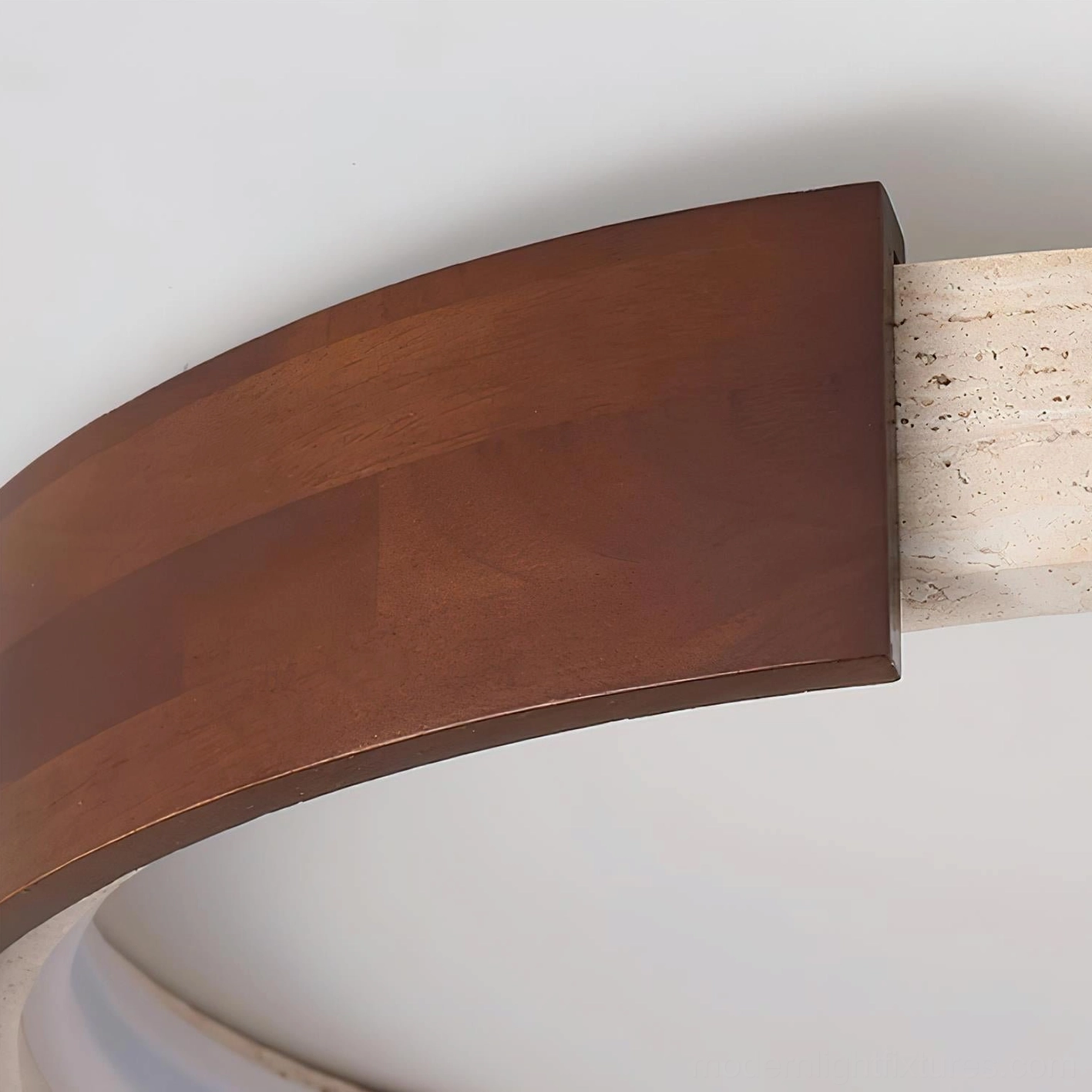 Halo modern ceiling lamp showing warm travertine stone with natural veining and character marks