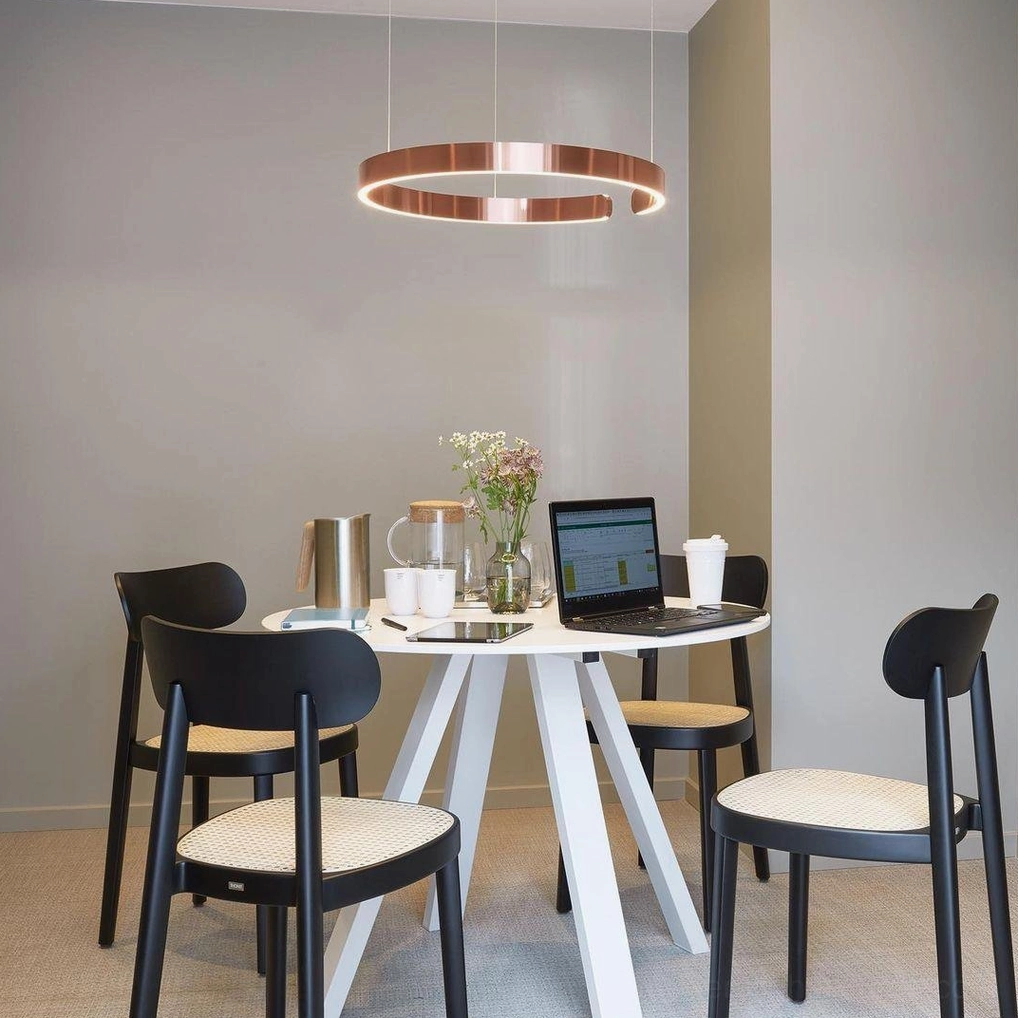 Halo LED pendant lamp with warm 3000K color temperature creating ambient evening lighting