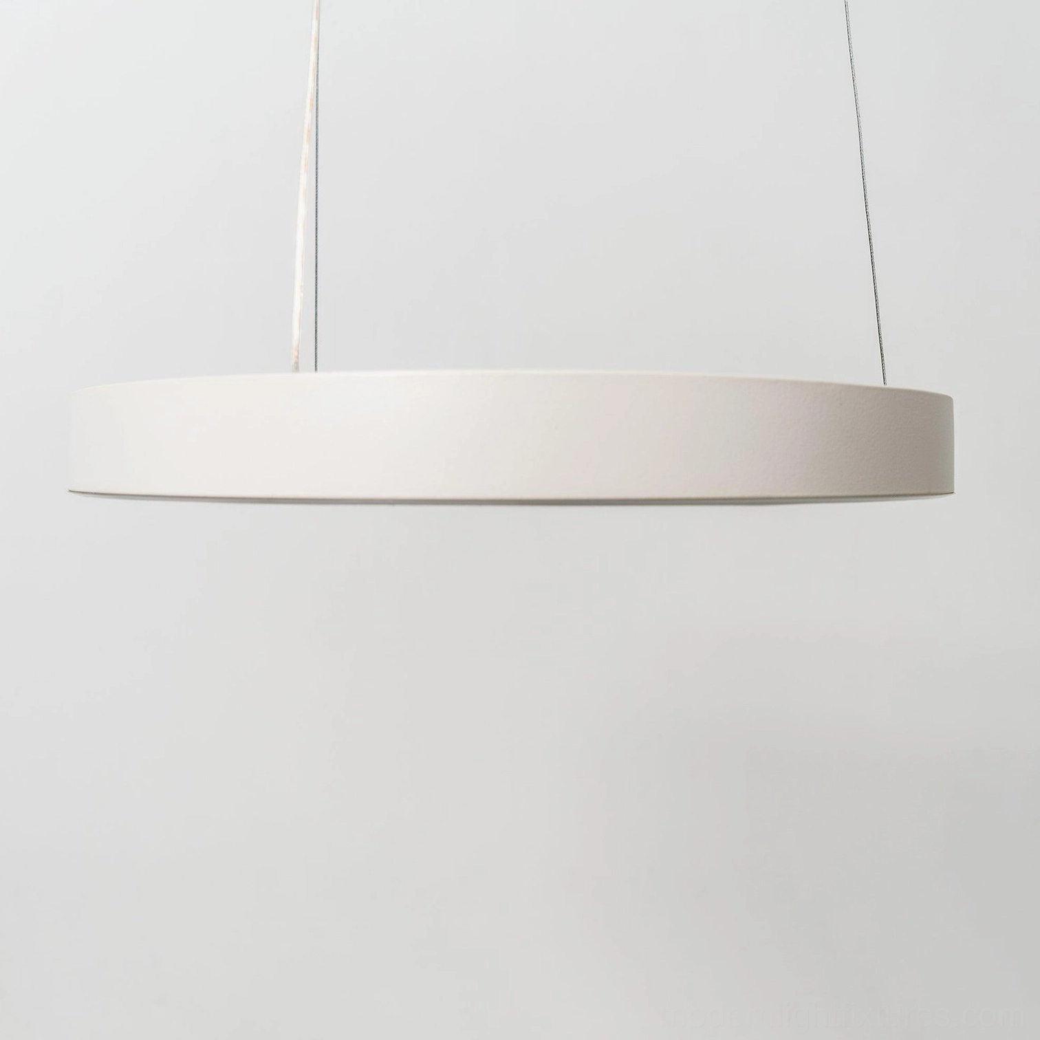 Halo ring pendant light architectural statement piece elevating entire interior aesthetic design