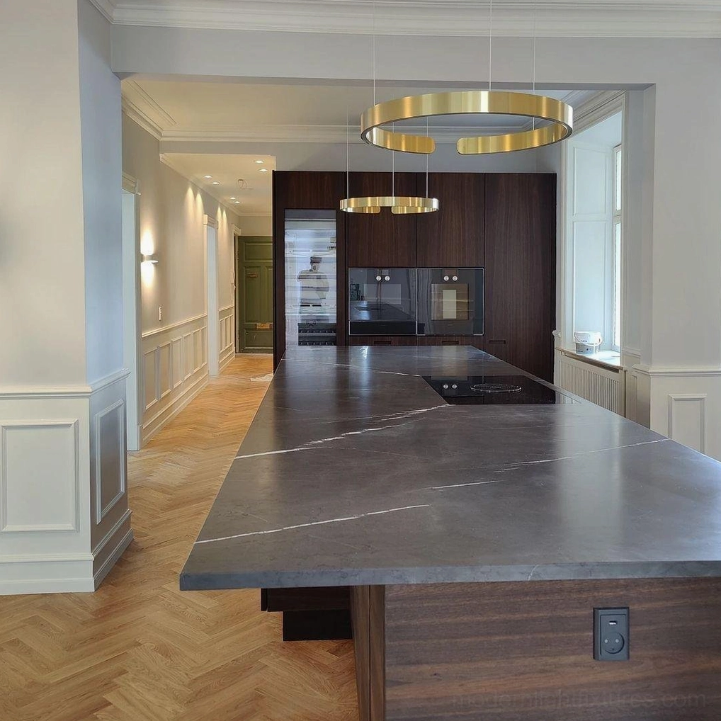 Cluster of halo ring pendant lights creating dramatic focal point in dining area with contemporary furnishings