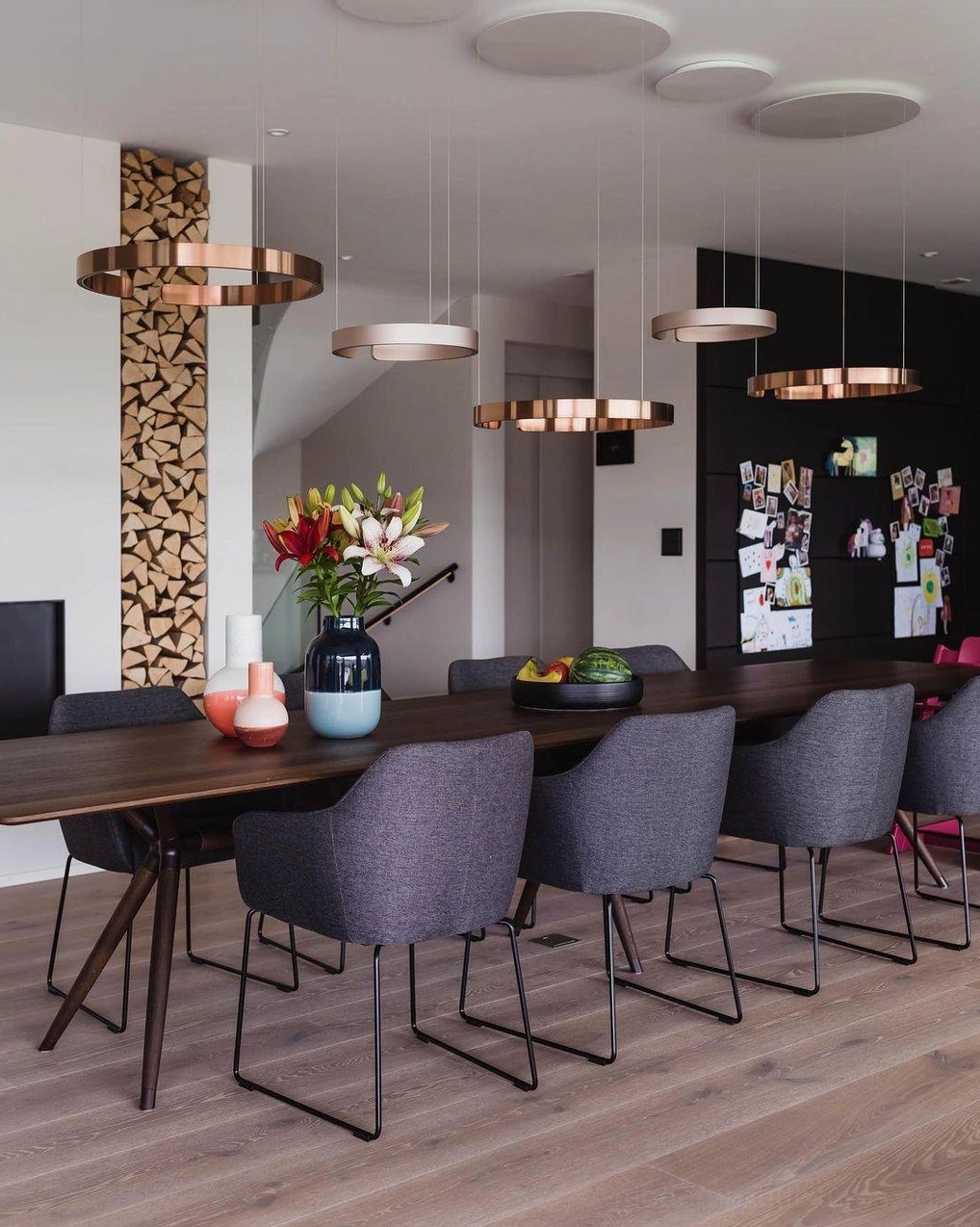 Halo LED ring pendant light with floating geometry effect creating artistic ceiling installation