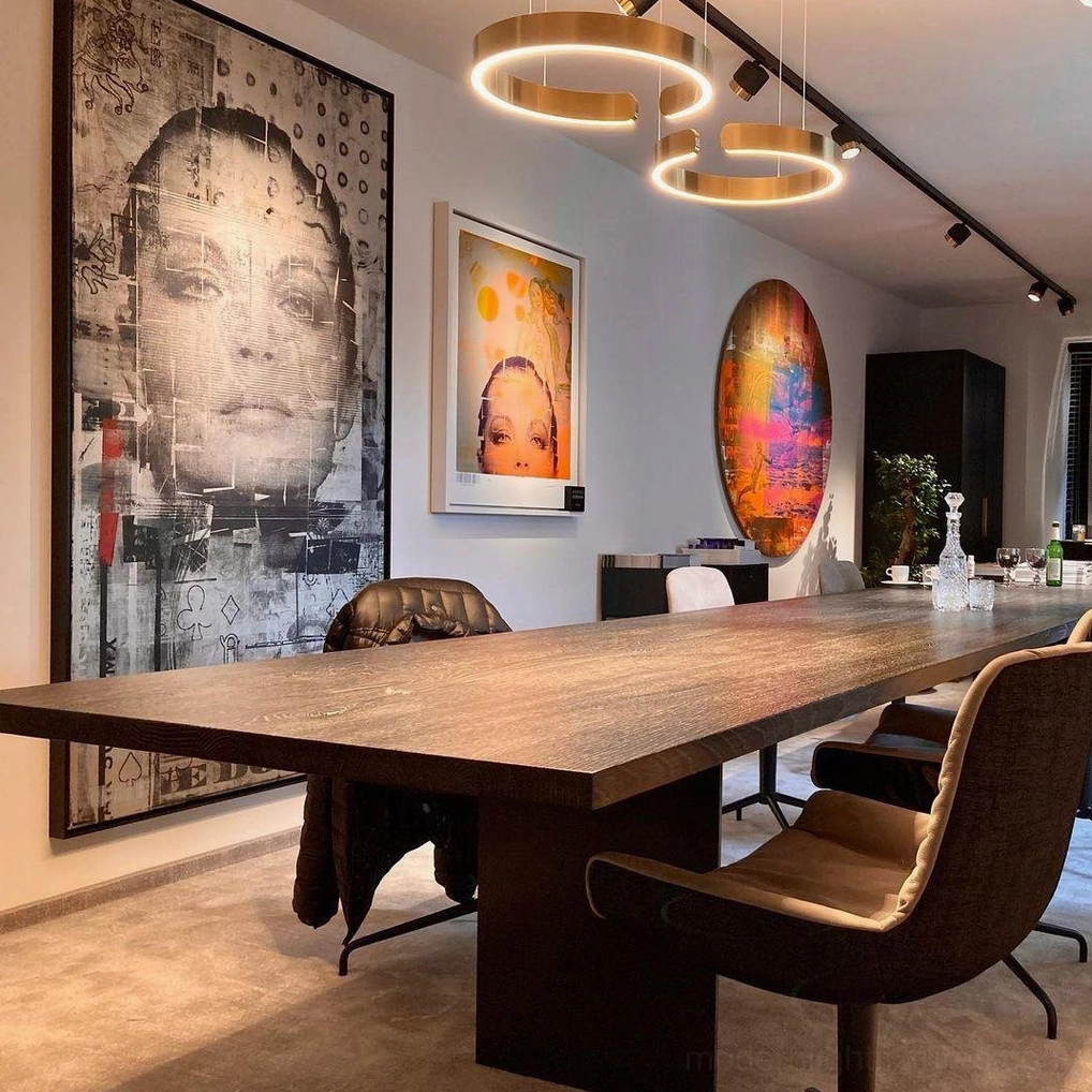 Multiple halo ring pendant lights creating geometric pattern installation in contemporary ceiling space