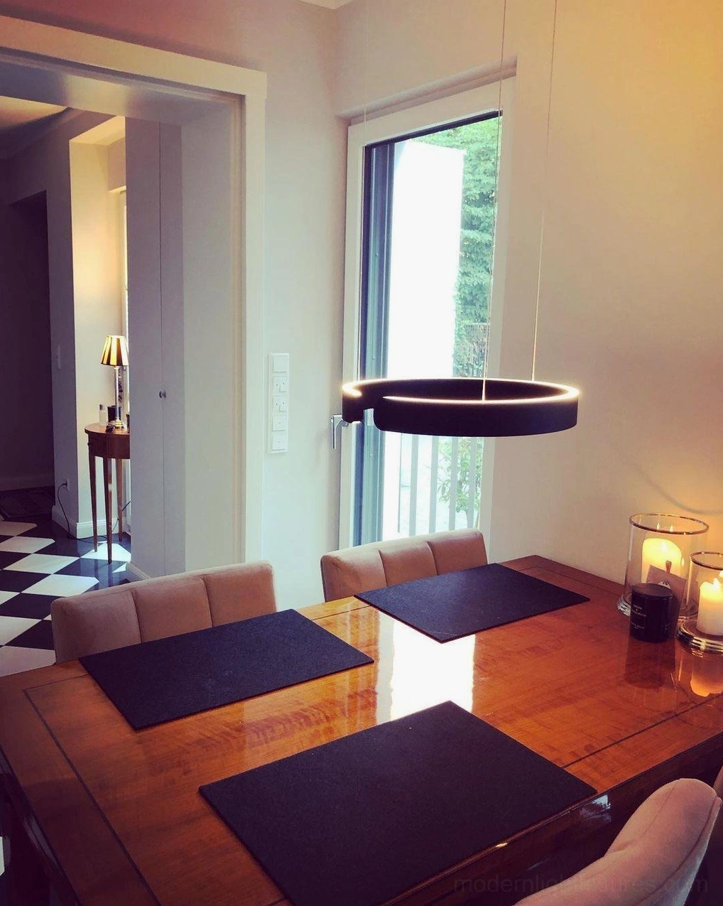 Halo pendant light creating stylish accent in contemporary home office workspace