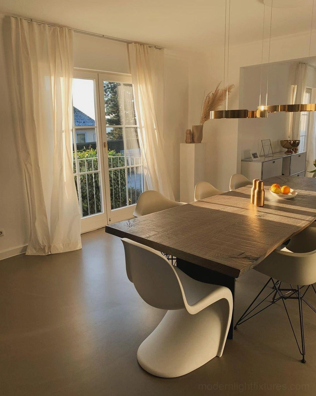 Halo ring pendant light creating visual rhythm in eclectic contemporary interior spaces