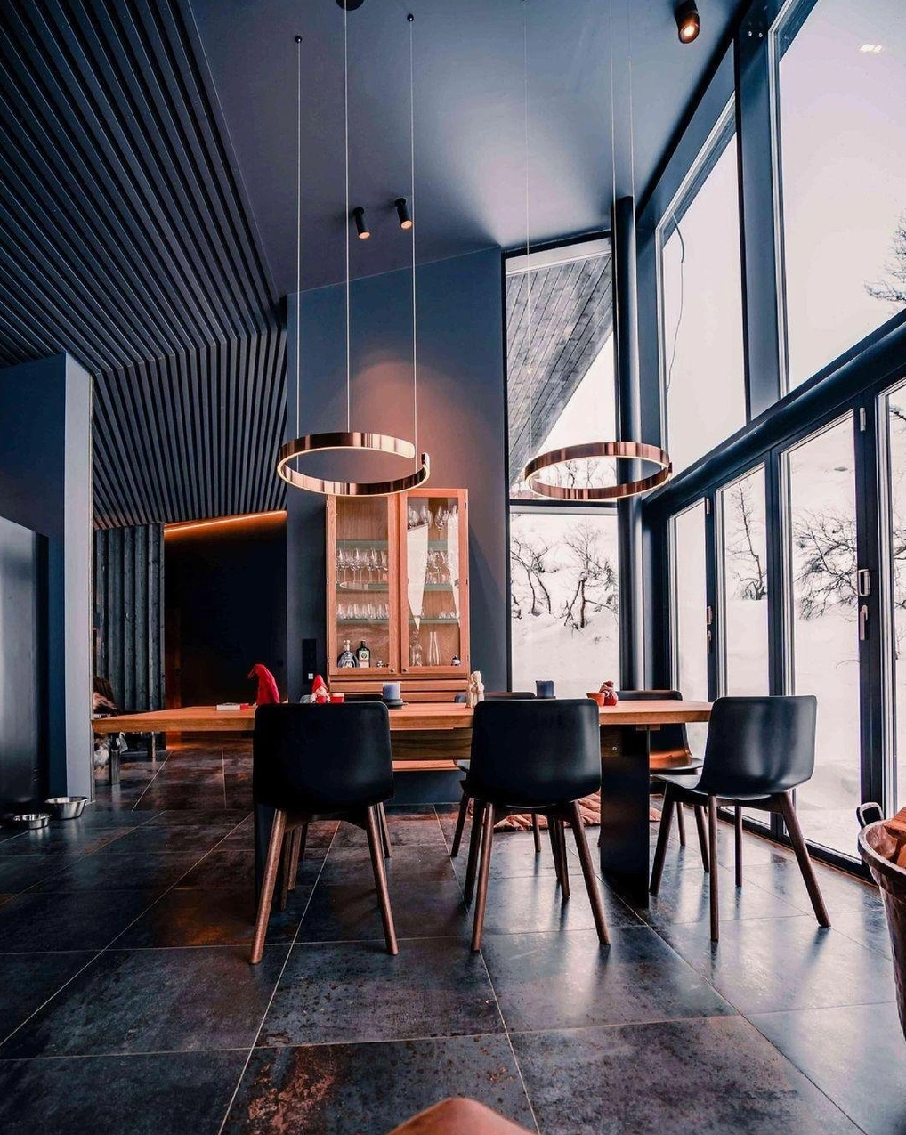 Halo LED ring pendant lamp pairing with warm wood tones for luxury interior design