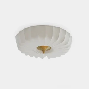Halo modern pleated ceiling light fixture with white fabric shade and brass finial, front studio view