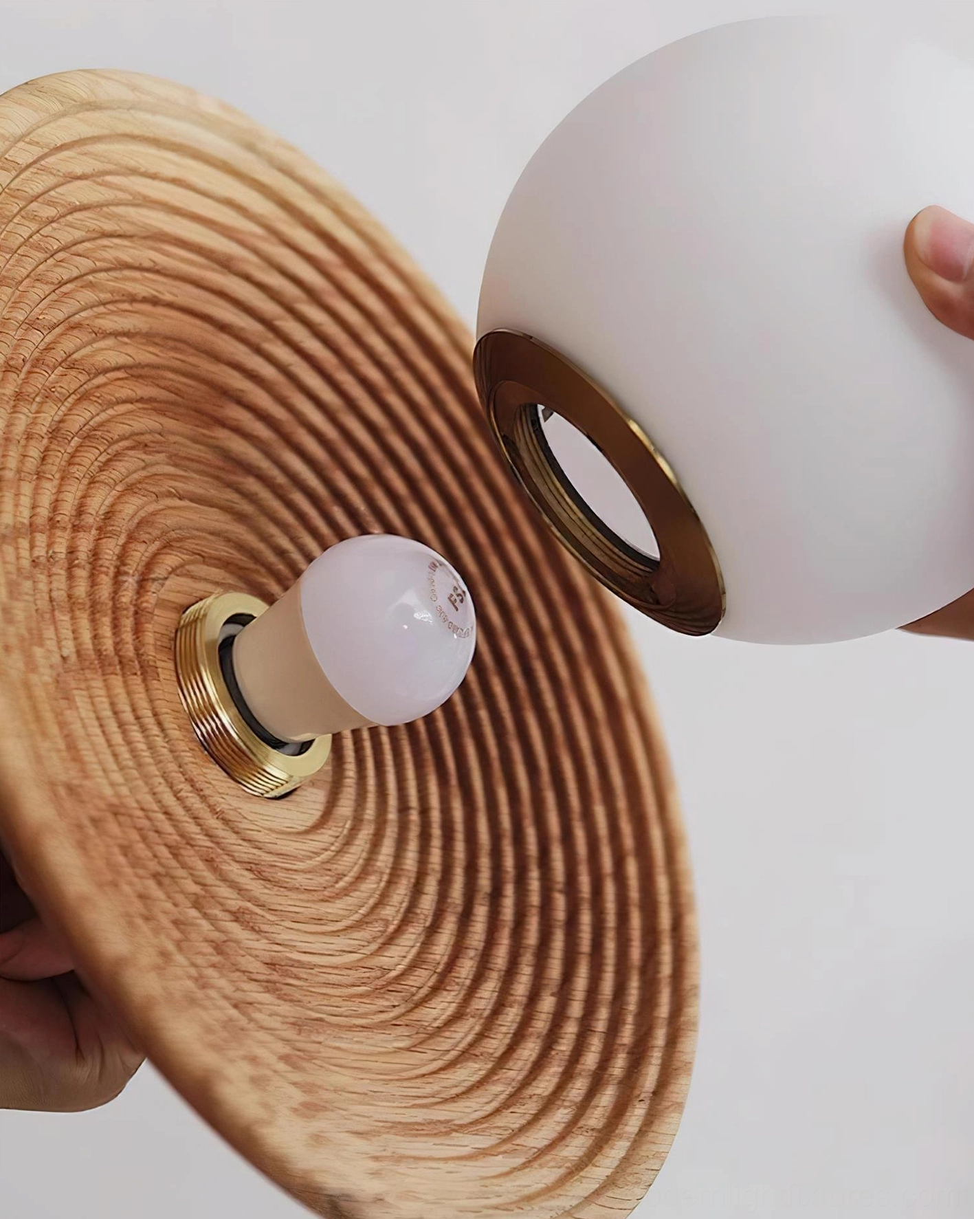 Halo wood globe pendant lamp showing assembly parts and ribbed wood texture detail