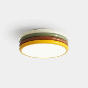 Hamburger ceiling light fixture close-up showing layered green, yellow, and brown color bands on white background