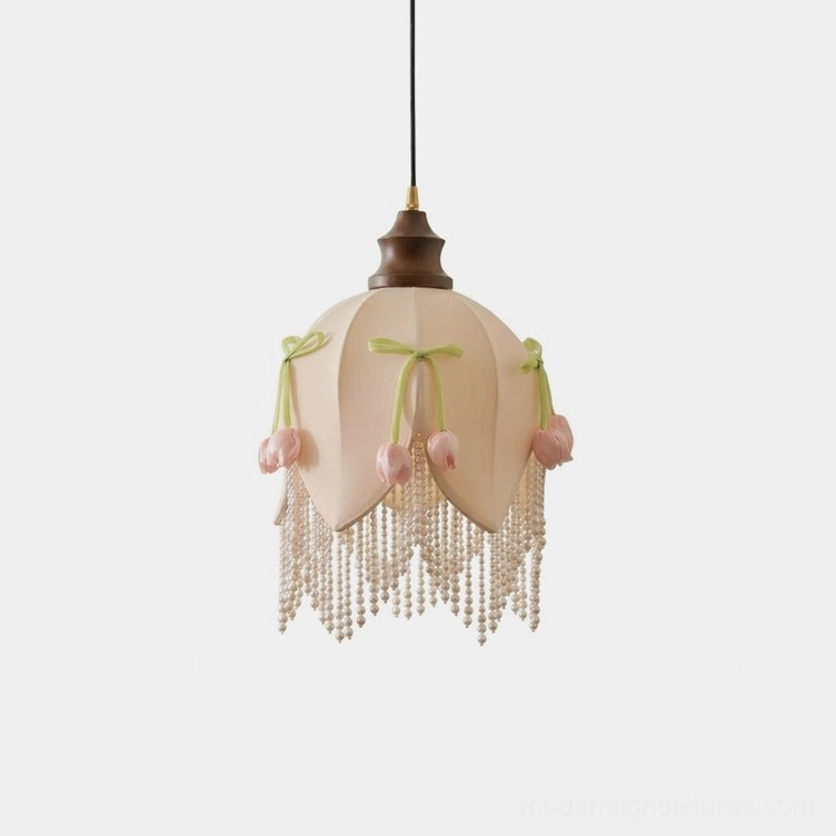 Hanavelle cream tulip pendant light with pearl fringe and green velvet bows, close-up front view against white background, showing detailed petal-seamed fabric shade and decorative trims