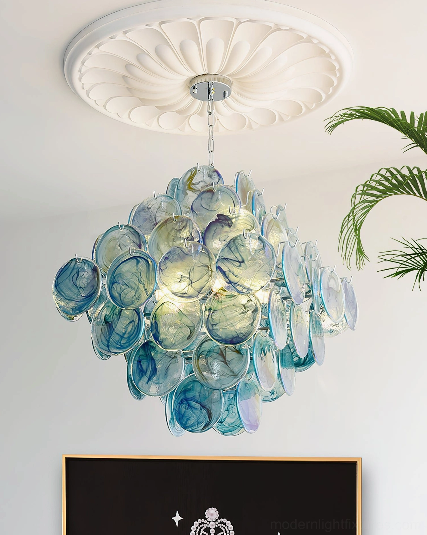 Hand-blown glass disc chandelier artistic view emphasizing sculptural design and gallery lighting aesthetic