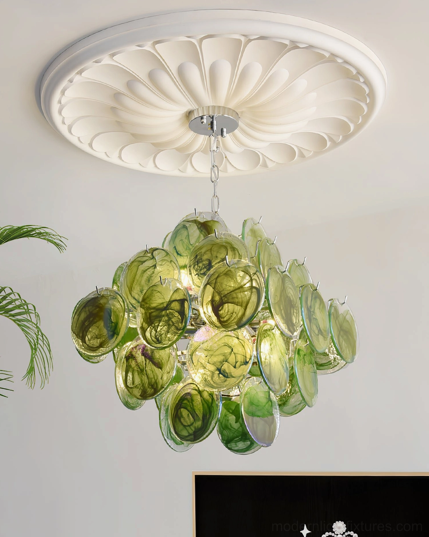 Hand-blown glass disc chandelier entryway foyer view creating welcoming gallery-like lighting effect