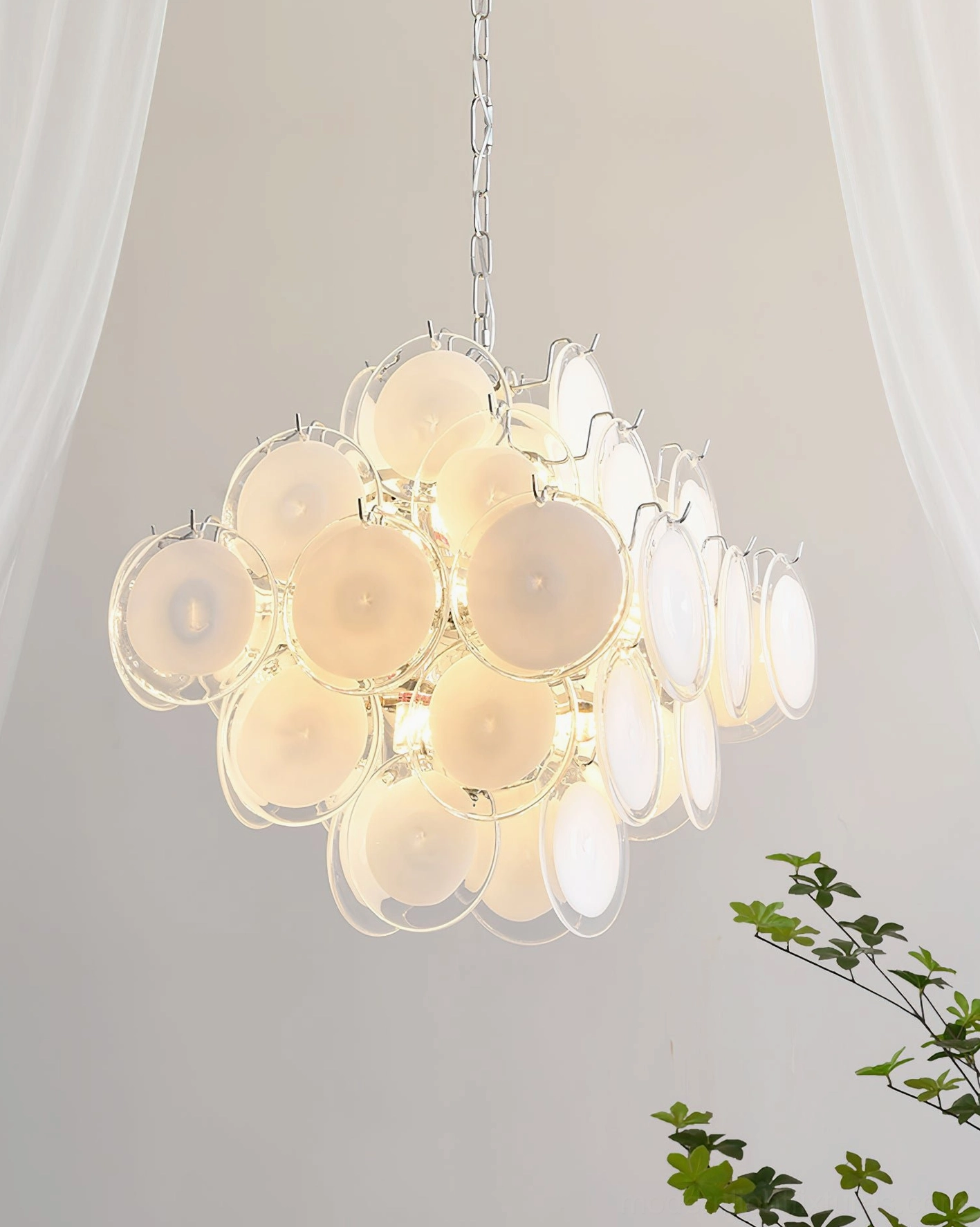 Hand-blown Murano glass disc chandelier architectural photography emphasizing form proportion and scale