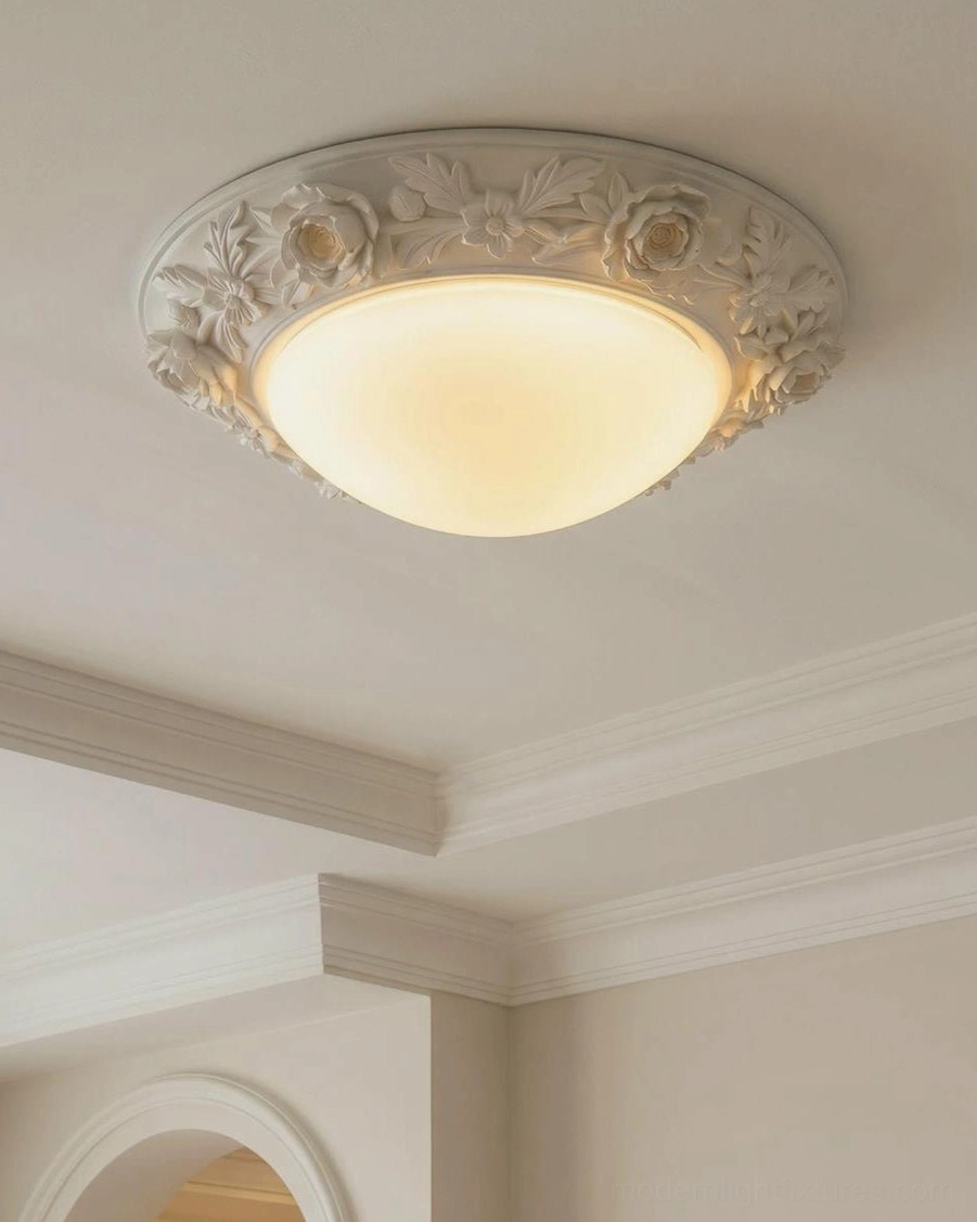 Hand-carved floral trim ceiling light fixture front view showing symmetrical rose-and-leaf relief pattern, all finish options